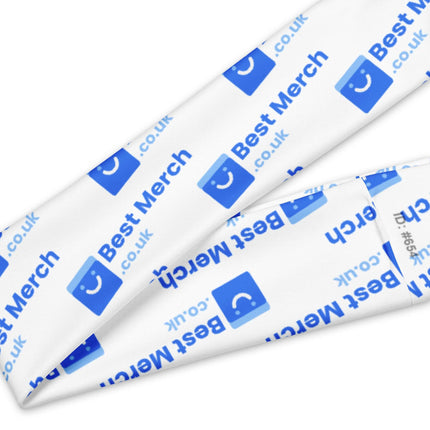 Detailed view of Headband - Best Merch branded fabric with blue logo print, highlighting soft texture and tear-away care label.