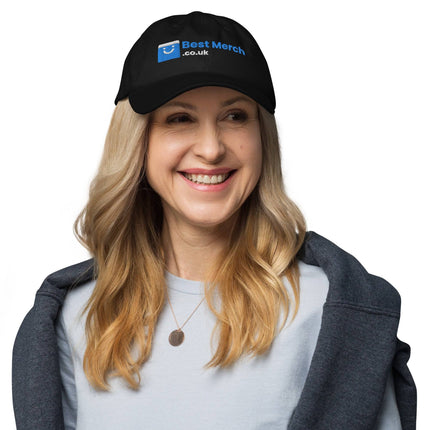 Black Baseball hat - Best Merch Branded on blonde woman smiling. Classic merch cap perfect for fans and casual streetwear.