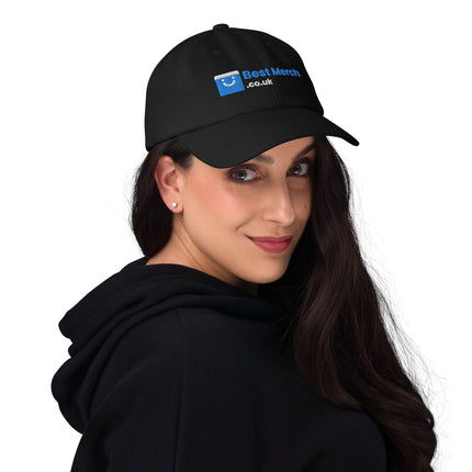 Black Baseball hat - Best Merch Branded modeled by woman in black hoodie. Sleek branded cap for stylish merch collections.