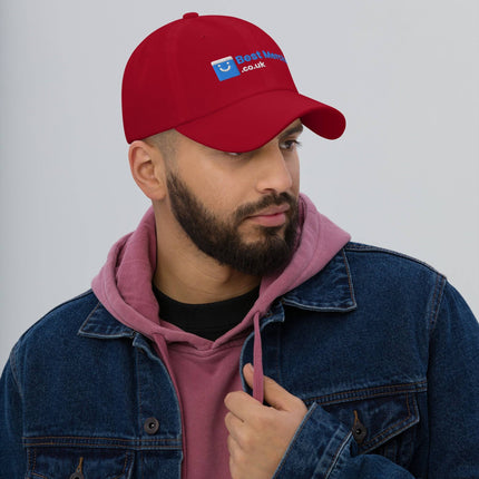 Red Baseball hat - Best Merch Branded worn by man in denim jacket. Bold colored merch cap adds vibrant style to casual outfits.