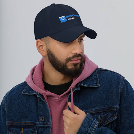 Navy Baseball hat - Best Merch Branded worn by man in denim jacket. Cool-toned merch cap for modern casual fashion.