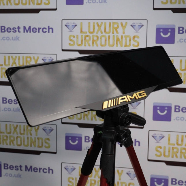 Gold AMG Plate Holder - Luxury Number Plate Holder mounted on a tripod, featuring a sleek black finish with gold AMG branding.
