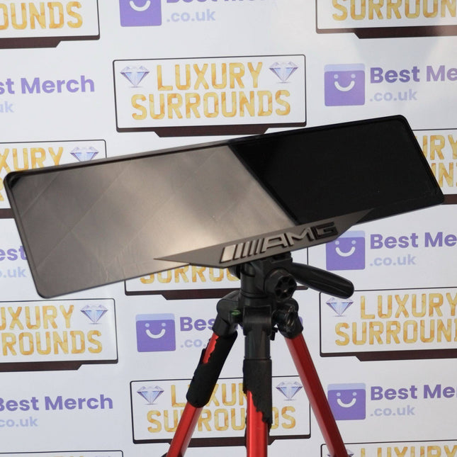 Black AMG Plate Holder - Luxury Number Plate Holder mounted on a tripod, showcasing sleek black finish and AMG branding for premium vehicles.