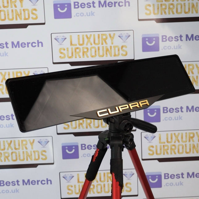 Gold Cupra Plate Holder - Luxury Number Plate Holder mounted on a tripod, featuring a sleek black finish with gold Cupra branding.
