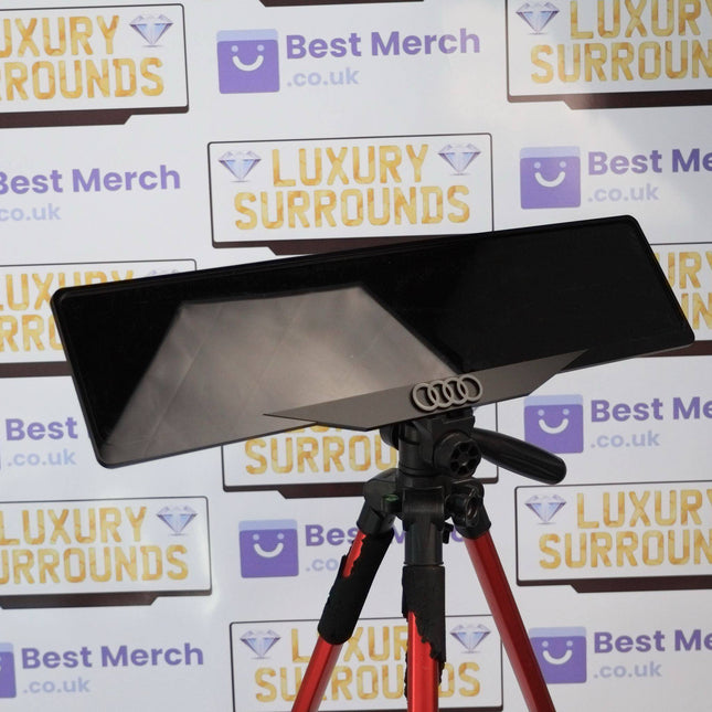 Black Audi Rings Plate Holder - Luxury Number Plate Holder mounted on a tripod, showcasing sleek black finish and premium Audi rings emblem.