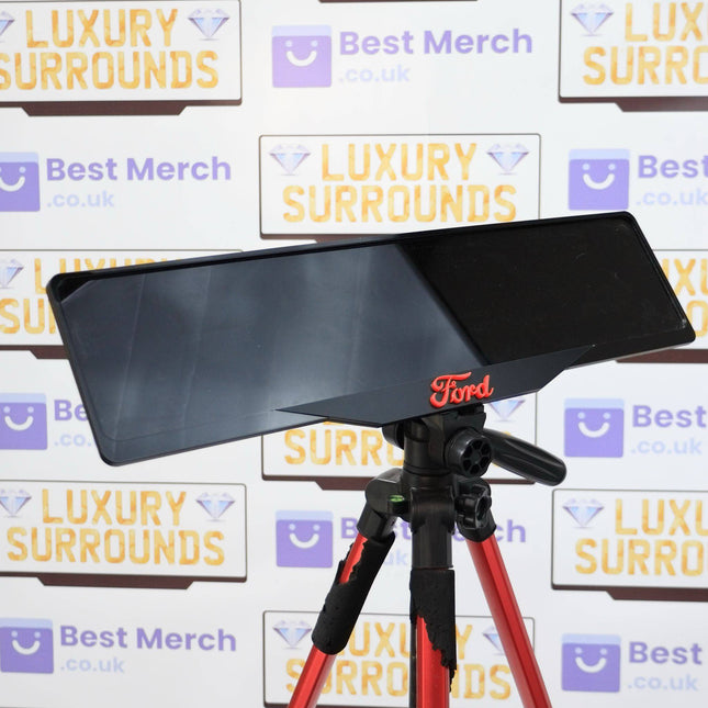 RED Ford Plate Holder - Luxury Number Plate Holder mounted on a tripod, featuring a sleek black finish with red Ford logo, ideal for vehicle decor.