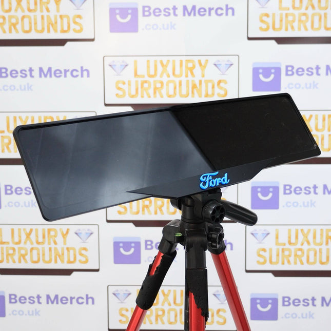 Blue Ford Plate Holder - Luxury Number Plate Holder mounted on a tripod, showcasing sleek black finish and bold blue Ford logo for premium vehicle decor.