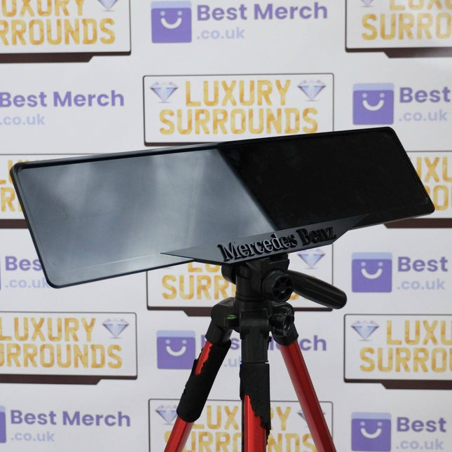 Black Mercedes Benz plate holder with luxury finish, mounted on a tripod, ideal for premium vehicle decor and license plate display.
