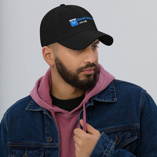 Black Baseball hat - Best Merch Branded worn by man in denim jacket and pink hoodie. Stylish merch accessory for casual wear.